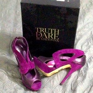 Purple shines and suede high heels.